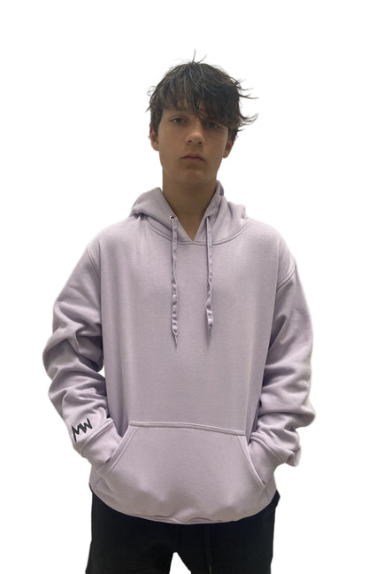 Person wearing a light purple hoodie with a logo on a plain background